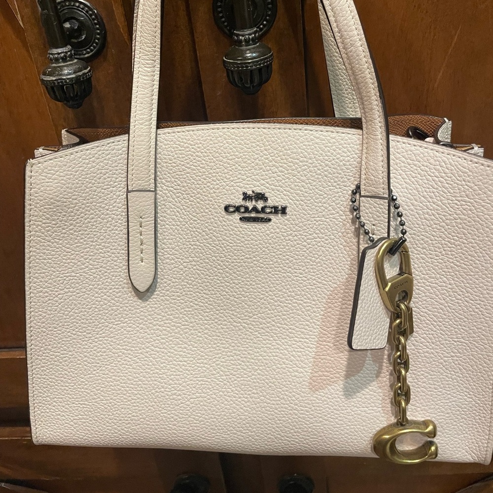 White never used Coach bad, shoulder strap included. Great bag.